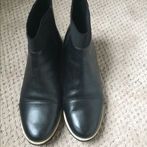 Black flat-heeled boots, size 9